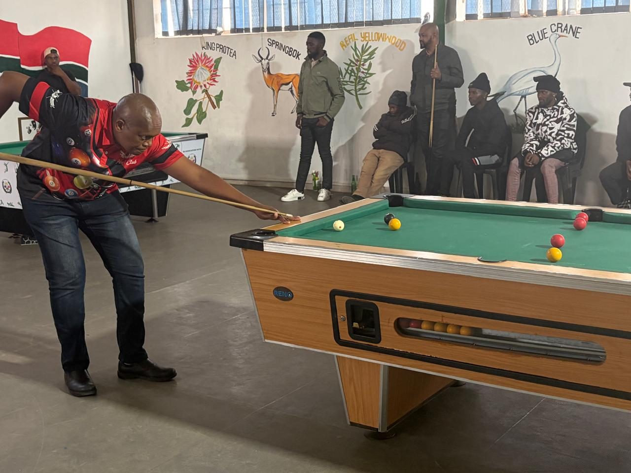 Player lining up a long shot during a tournament