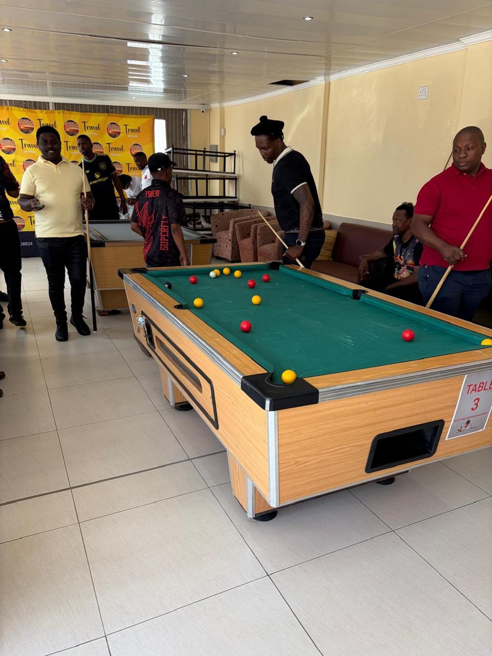 Pre launch event guests around the pool tables