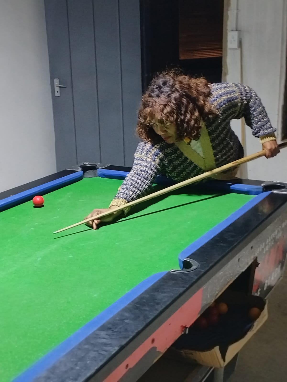 Practice evening among the tables in the clubhouse lounge
